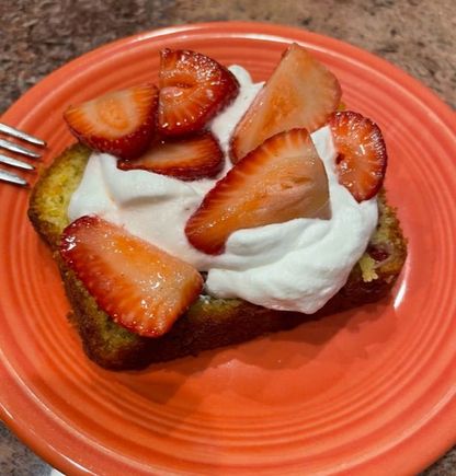 Last night’s dessert. Olive oil cake with strawberries and whipped cream. 