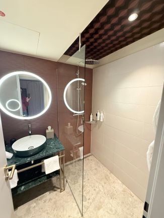 Rain shower with handheld. Bath products are from Molton Brown