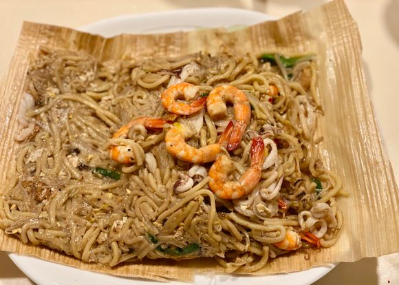 Fried Hokkien mee wrapped in opeh leaf