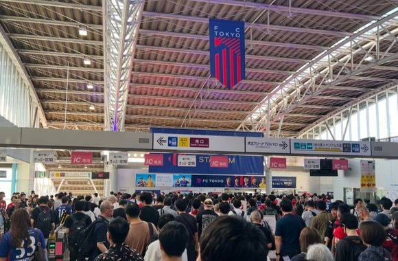 Crowd at Tobitakyu Station heading for the match.