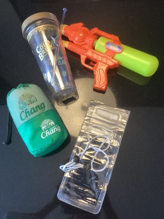 Water pistol, phone pouch, keep cup and towel.