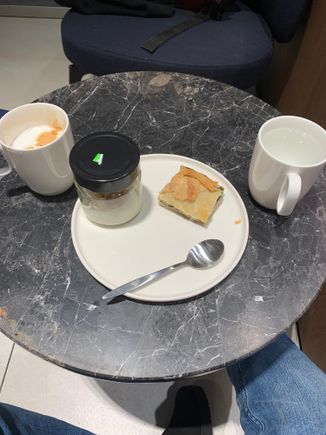 Cappuccino, rice pudding, spinach pie and water. I couldn’t find any water glasses at the water station so used a coffee cup.