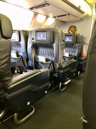 Tired and worn 737-800.  14 of 16 First class seats were occupied, 30 of the 150 Economy seats were.