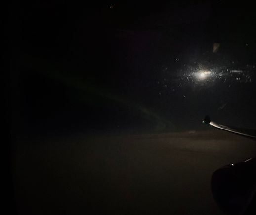 full moon reflecting off the wing