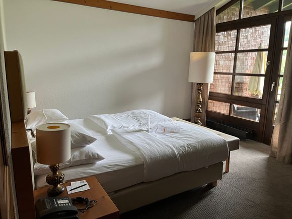 One-Bedroom Suite: Master bedroom with balcony 