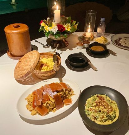 Babi guling and paku gulai / roast pork on spit and forest fern in coconut milk