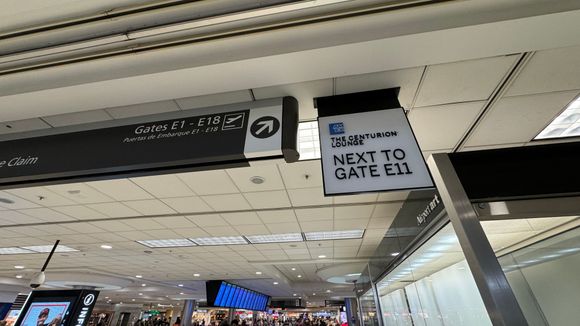 Signs upon coming up the escalator to Term E.