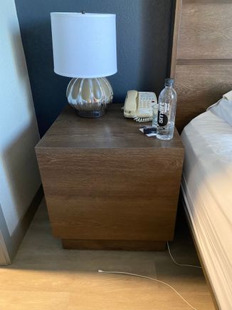 No easily accessible plug on either side of bed. You must pull the nightstand away from wall and use plug back there. 