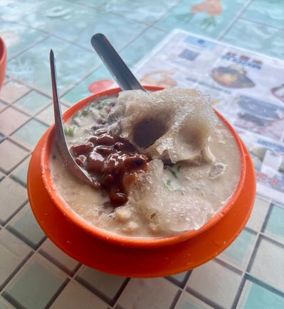 Cendol, a typical dessert of shaved ice, brown sugar, red beans and gelatine green worms.
