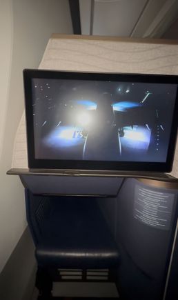 Notice the tray that fold up diagonally…this exponentially increases knee room. Also notice how the cubby is both taller and longer than on the qsuite.