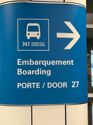not above the wing, but amusing for avgeeks … the city bus from Montreal Dorval to downtown is the Route 747