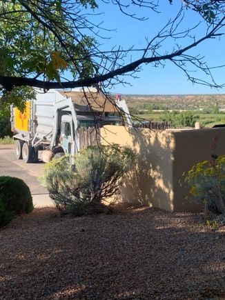 7 AM garbage truck out my bedroom window. 