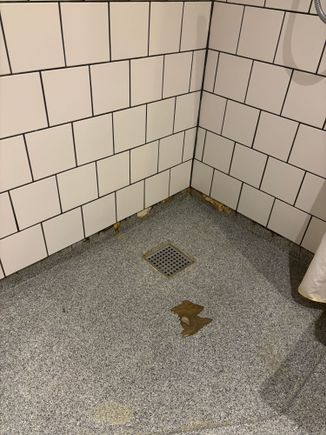 Shower worn to subfloor