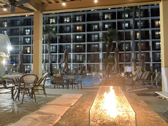During dusk, the Jigger's bar patio has its fire started, giving it a nice cosy feel to have a drink while popping into the pool or hot tub. 