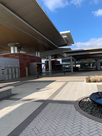 Out the front to a courtyard with the skybridge to the terminal to the left. 