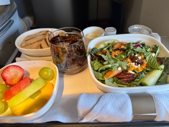 Arrival: Tuscan kale arugula salad with roasted sweet potatoes, baby carrots, granny smith apples, fresh mint, candied pecans, goat cheese, creamy avocado Italian dressing and side of grilled chicken