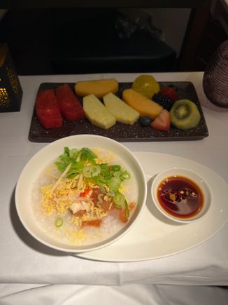 The crew noticed I was quite sleepy and kindly served the starter and main together. 

Fruit platter and king crab congee