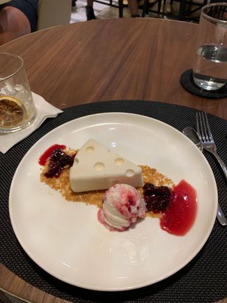 NY cheesecake with ice cream and cherry compote