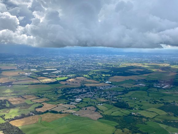 Just dipping under the cloud over Glasgow
