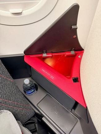 Storage areas, with wireless phone charging, which didn't work well with my phone.