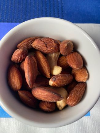 Nuts were lukewarm, and except for two cashew fragments were all almonds. I was still grateful to have them, because as soon as they were served we hit heavy turbulence and had to delay the rest of the meal service.