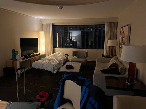 Living room with rollaway (city view); no door to bedroom