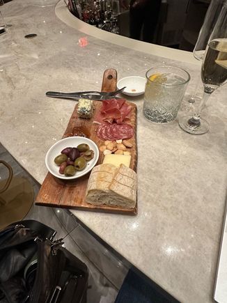 Meat and cheese board. Missing either more bread or crackers. 