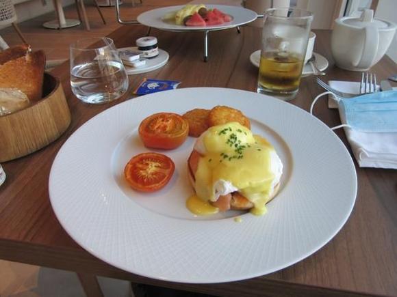 Eggs Royale with an additional request of grilled tomatoes + hash browns