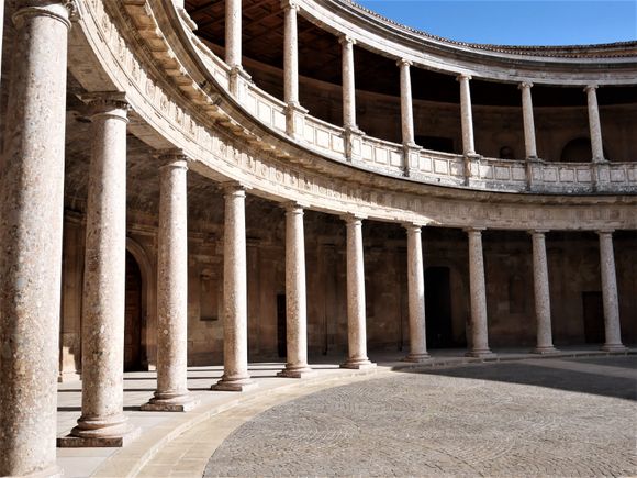 Doric-Tuscan pillars on the lower level, and Ionic columms on the upper level. - The Palace of Charles V. 