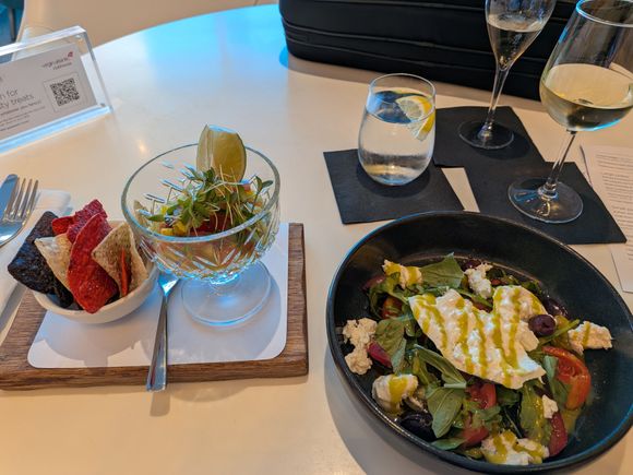 The burrata and tomato salad was great.  The shrimp ceviche was very good.  The chicken wings and flatbread were a pass, especially the wings.  Flatbread would have been better if it were cooked a bit more.
