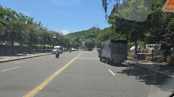 There is a road between both sides of the hotel