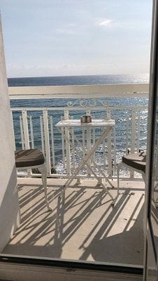 Picture from room of balcony overlooking sea