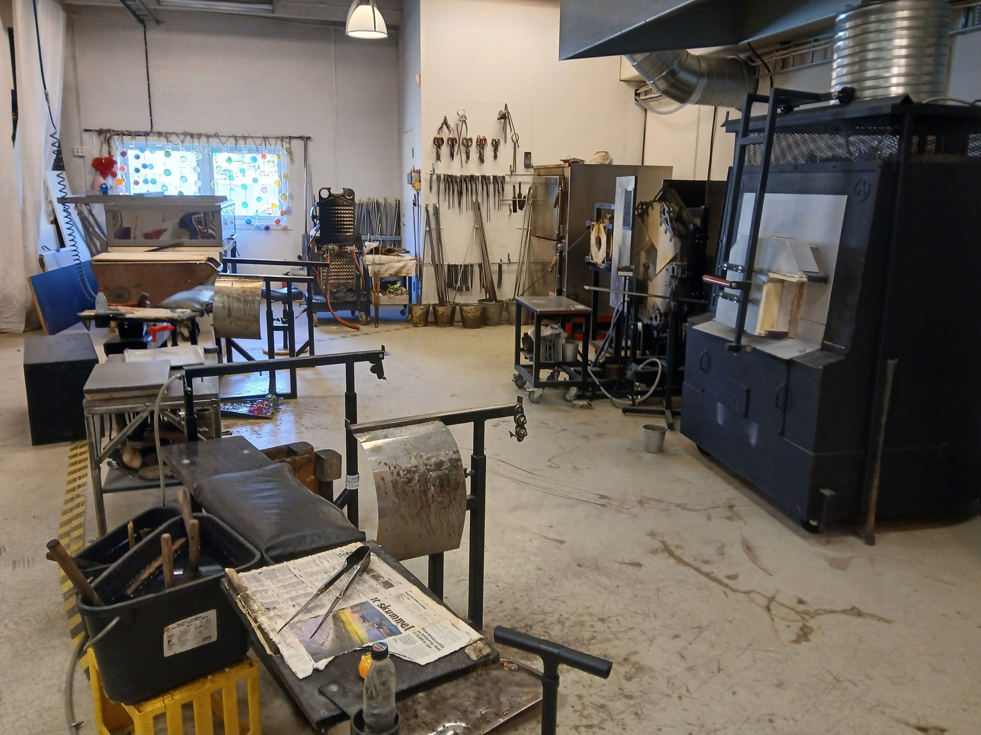 The workshop, with the furnaces. Theyve baked a pizza in the