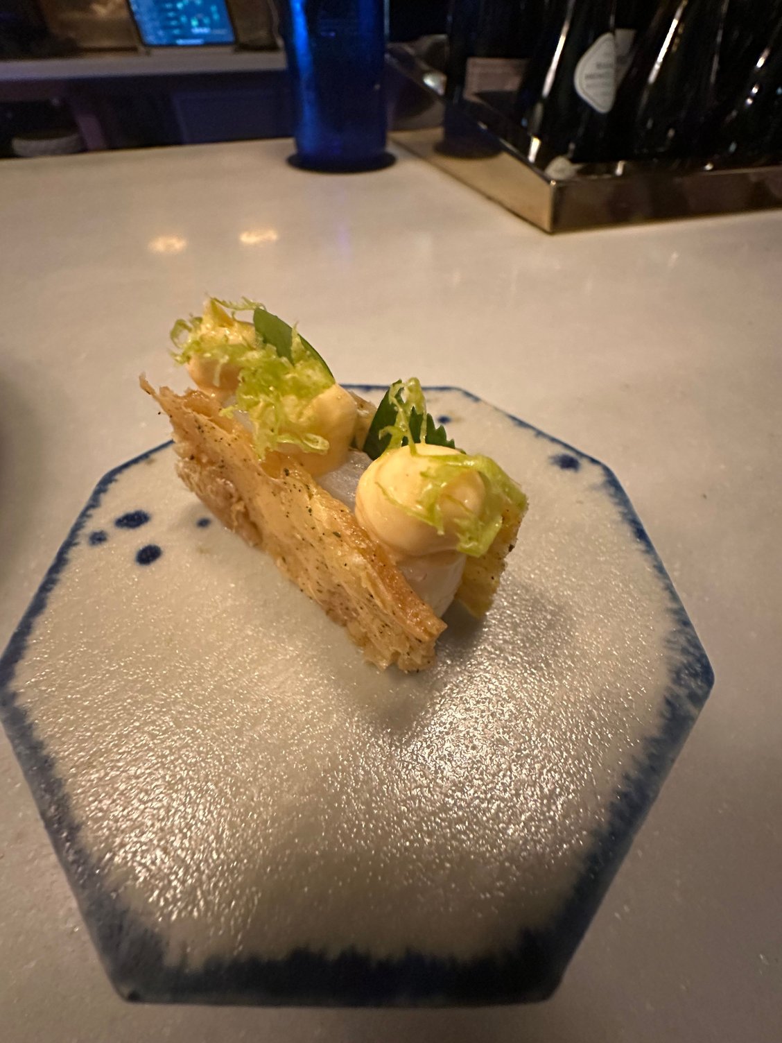 MONT BAR�s creative Catalan �mar i muntanya,� or sea and mountain combined in one dish.  This is warm squid sandwiched between impossibly crackly chicken skin
