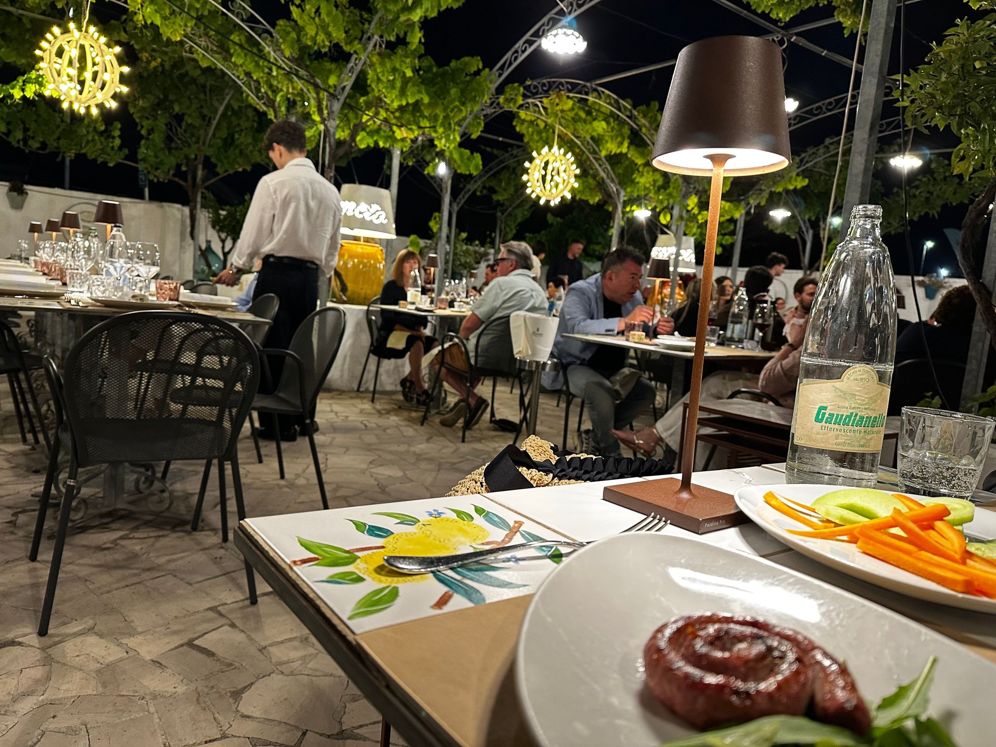 Tables set up for the party; guests seem to trickle into dinners about an hour after the scheduled time; I always asked our hotel to phone if I thought awe would be a half hour late; they did call, but they always joked with me that it did not matter..no one shows up on time in Puglia..for anything!!