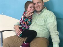 Violet signing I Love You before her MRI