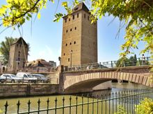 The Barrage Vauban
This fortified bridge was a cornerstone of the city’s defenses from the 1600s when it was built, until as recently as the Franco-Prussian war in 1870.  The walkway inside has some interesting stonework your camera will love, but even better is:
