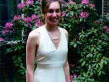 Pretty and elegant. Nice dress,  beautiful smile.