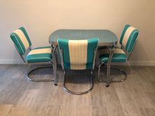 Here is our little treasure. The tabletop has a wavy design which my phone won’t capture. There’s a fourth chair too. 

We’re leaving Friday and we have gotten most of what we had wanted to get done accomplished.
I will miss this little house which already feels like my real home. 

We’re eating out  with a friend tonight at our favorite Chinese place. I had wanted to try a new Eritrean place but the chairs look awful and I’m not up for discomfort.