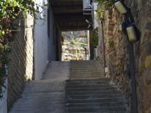 At about the midway point in the stairs going up.