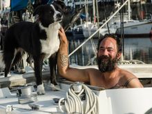 Lulu and her friendly owner in the modern marina. He looked like we felt: half-awake from loss of sleep. Above him was the massive, modern Grand Pont bridge.
