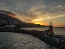 Arriving safe and sound (except for one cracked lens cover) back at Ischia's Porto. Its faro guides us in. Mt Epomeo rises 800m just behind. A couple months prior, its slopes had experienced a terrible mudslide. People lost their lives. One of our taxi driver's elderly in-laws barely escaped, but lost everything. We were told differing reasons as to the cause, from unenforced municipal buildings laws to a simple act of Mother Nature--she always bats last.
*next: the Aragonese Castle