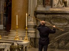 Lighting the candles at the basilica Laterano.