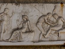 I'm a History major who has worked on one archaeological dig. Here on the right, brave Achilles renders aid to Telephus, the injured son of Hercules. Achilles does so by scraping magic rust off his own spearhead, to apply to the gut wound. 
The scene on the left shows fair Achilles consulting with the Delphic Oracle in Greece.