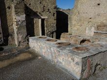 This Herculaneum fast food joint reminded me that Pompeii has recently uncovered some more exceptional remains of eateries just like this. Each vat would've contained a different food: stews, seafood, garum, wine, grains and more.
