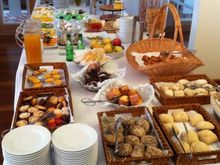 Breakfast pastries, including "natas"