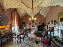 Her dining parlor, described in the signage as like "eating under the udders of a cow"