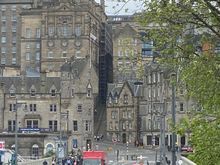 Walking across Waverley Bridge to Old Town. We love the architecture and ambiance.