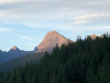 Tall pile of rocks with the sunshine waining.