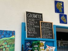 Snack bar sells granita (ricotta granita with candied capers, anyone??) gelato, and a few simple story dishes, most of which include fish). Granita=4 euro.